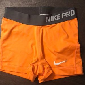 Super cute bright orange NG Nike pros